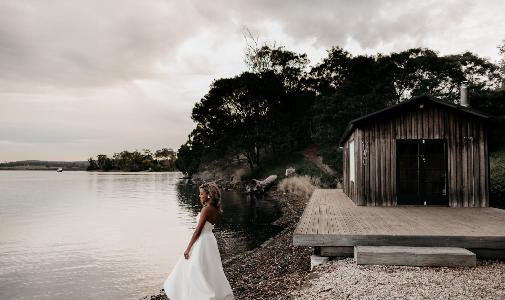 Waterton Hall estate - Waterton Hall Boatshed and bride on the edge of the Tamar River... Photographer Fiona Vail